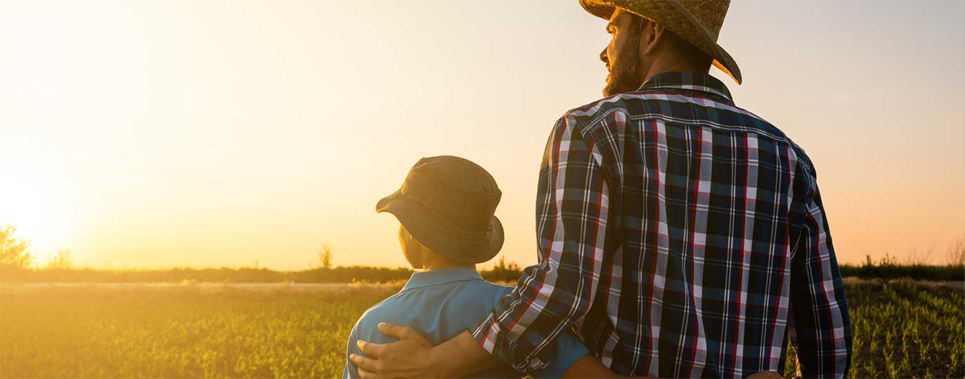 Father and son watching a sunset